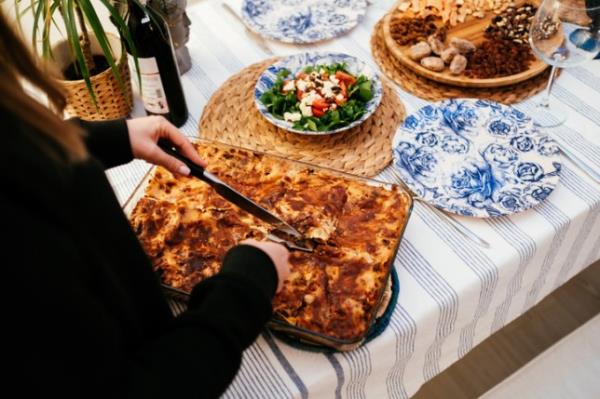 Woman setting a dining table for housewarming