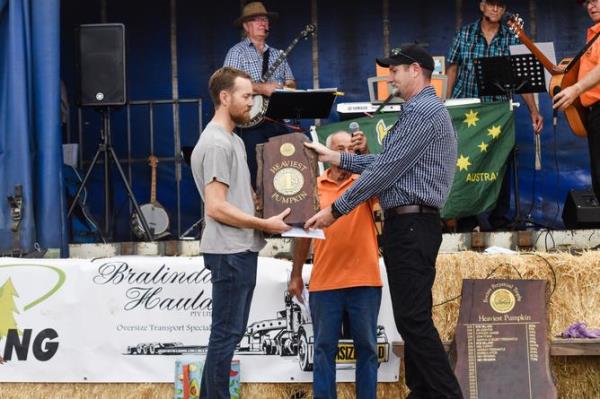 Mark Blyth receives his award from Damien Benson.