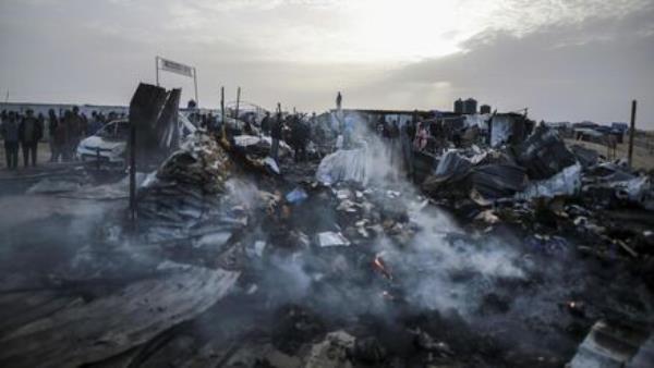 Palestinians look at the destruction after an Israeli strike wher<em></em>e displaced people were staying in Rafah, Gaza Strip, Monday, May 27, 2024. 