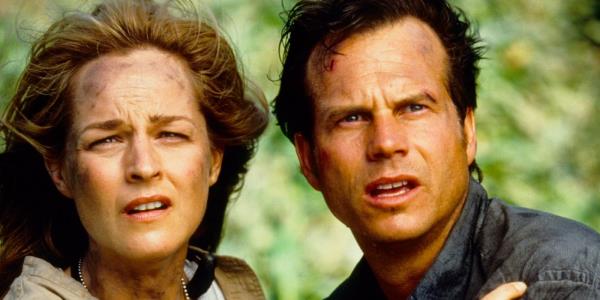 Helen Hunt as Jo and Bill Paxton as Billy looking shocked in Twister