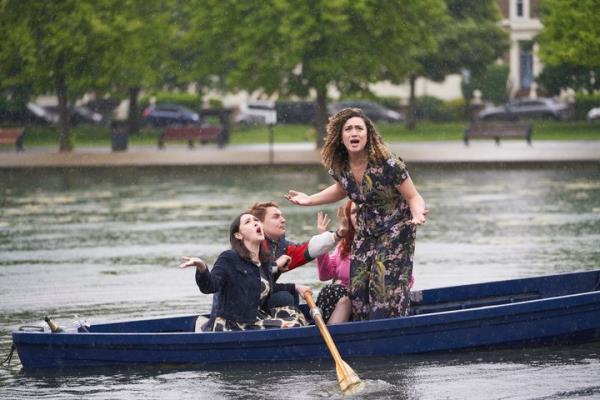 Jessie preparing to make a grand romantic gesture to Tom, while drenched in rain.