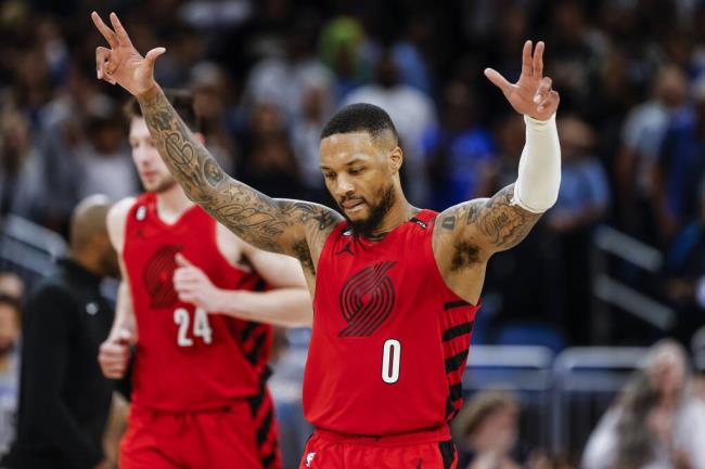 Portland Trail Blazers guard Damian Lillard celebrates after a shot against the Magic during the second half March 5 in Orlando, Florida (Kevin Kolczynski / ASSOCIATED PRESS)