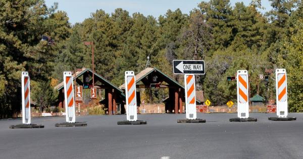 FILE - The main entrance to Grand Canyon Natio<em></em>nal Park remains closed to visitors in Grand Canyon, Ariz., due to the government shutdown, in October 2013. Arizona Gov. Katie Hobbs and Utah Gov. Spencer Cox say that the ico<em></em>nic parks they look to keep open amid a possible shutdown are im<em></em>portant destinations and local communities depend on dollars from visitors. (AP Photo/Ross D. Franklin, File)