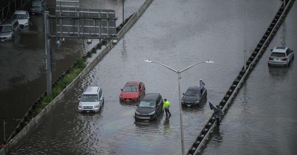 First respo<em></em>nders wade through flood waters at the ba<em></em>se of the Williamsburg Bridge, Friday, Sept. 29, 2023, in New York.