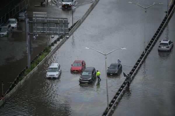 A general view shows cars stranded in floodwater on the FDR highway in Manhattan, New York on September 29, 2023. (Photo by Ed Jo<em></em>nES / AFP) (Photo by ED JONES/AFP via Getty Images)